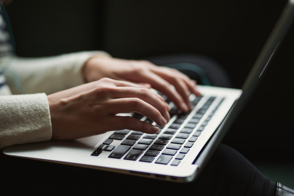 Someone Typing on a computer to show that blog marketing is an option